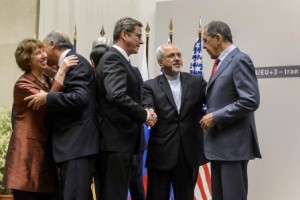 (L to R) EU foreign policy chief Catherine Ashton, French Foreign Minister Laurent Fabius, German Foreign Minister Guido Westerwelle , Iranian Foreign Minister Mohammad Javad Zarif  and Russian Foreign Minister Sergei Lavrov reacts after a statement on early November 24, 2013 in Geneva. World powers reached an agreement with Iran over its nuclear programme, their chief negotiator Catherine Ashton and Iran's foreign minister said.    AFP PHOTO / FABRICE COFFRINI